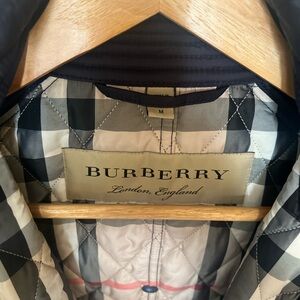 Like new, Burberry belted trench coat